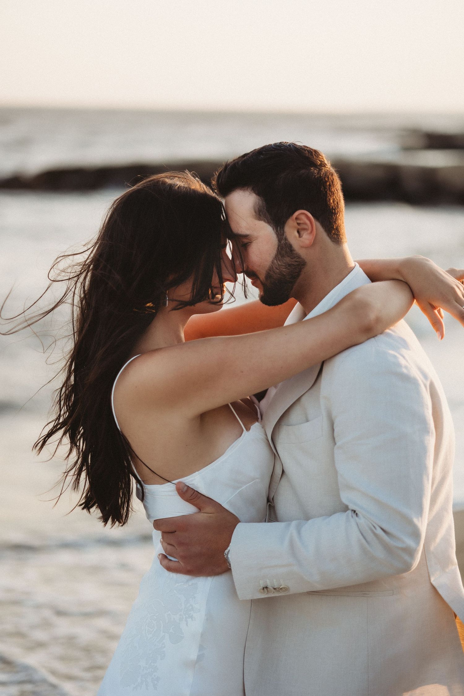 Romantic Maui wedding portrait of bride and groom with foreheads together.