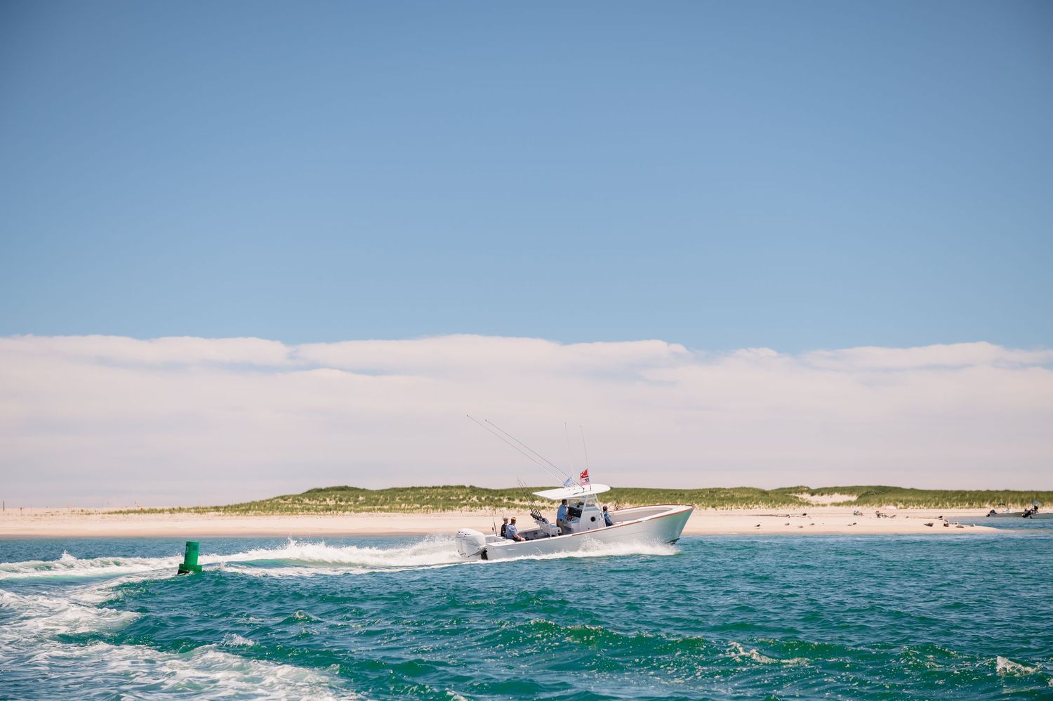 Fishing boat cruising through the ocean waters.