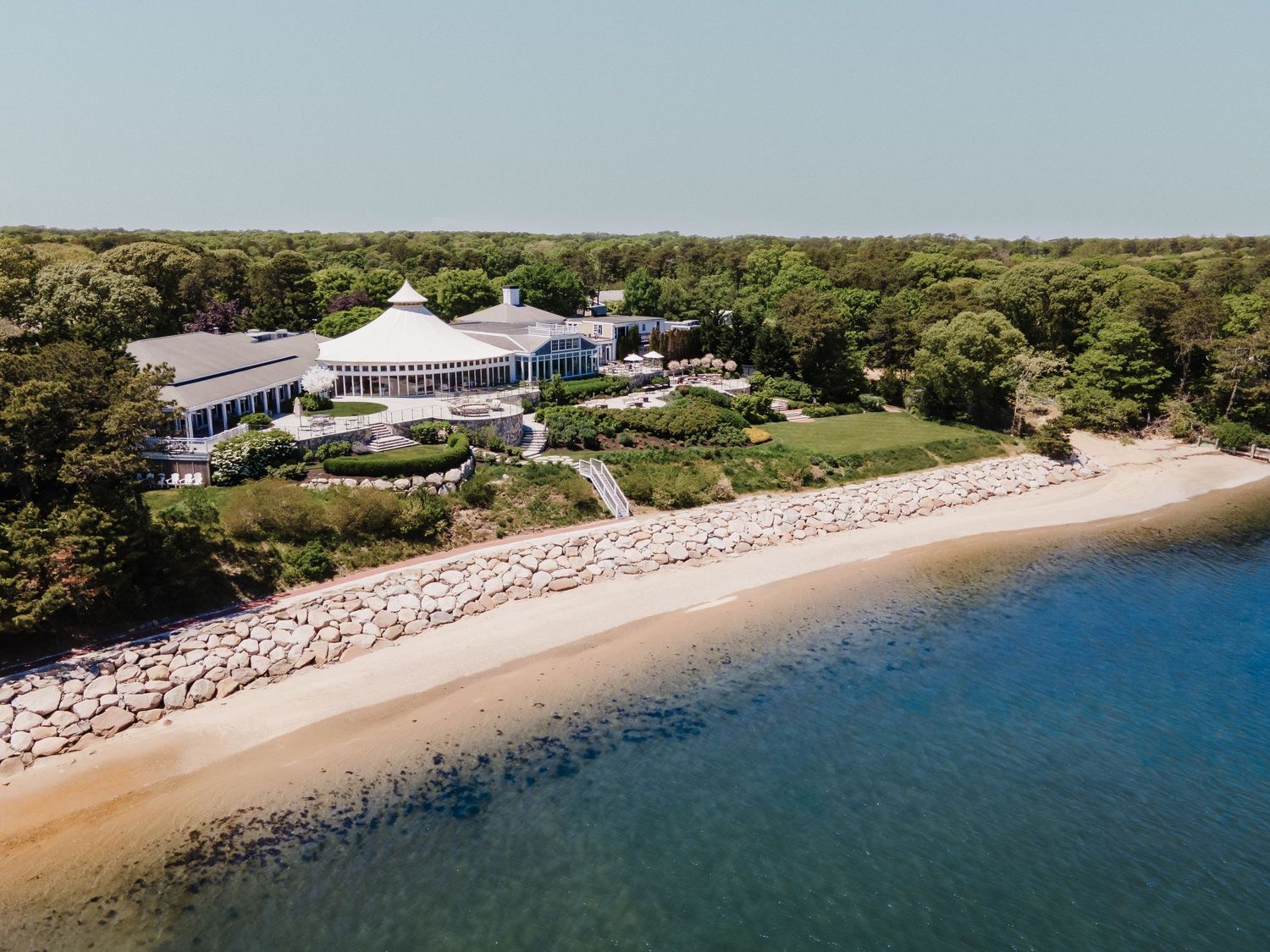 Drone shot of a resort hotel overlooking the sea.