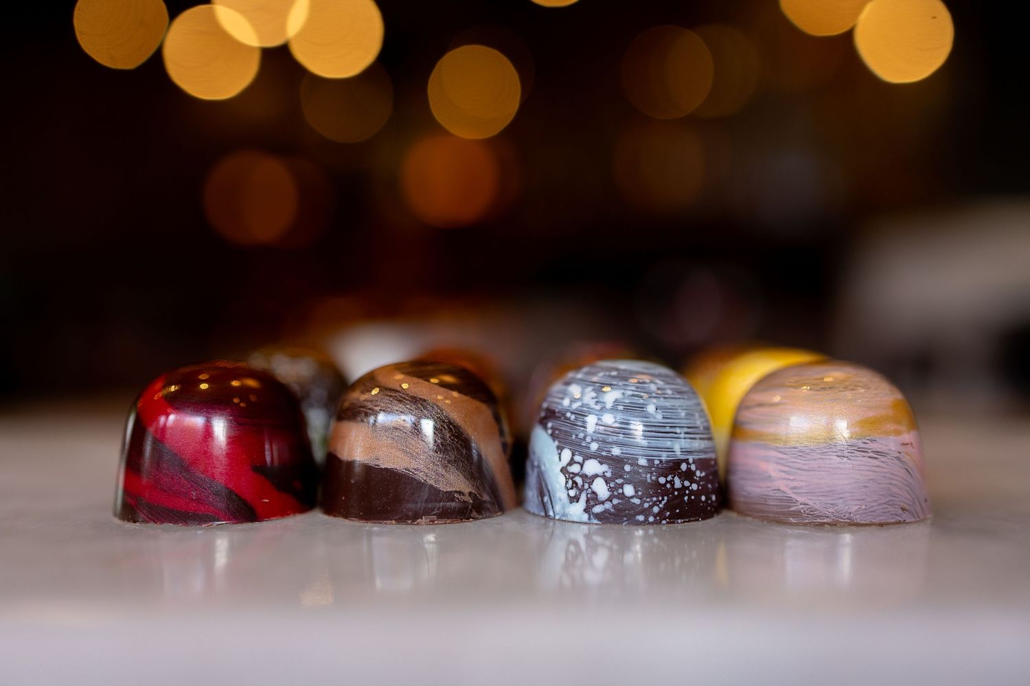 Gourmet chocolate truffles arranged on a plate. Maui food photography of chocolate truffles