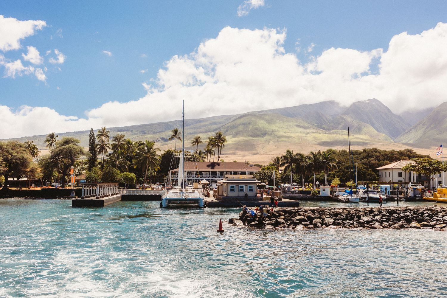 Lahaina harbor fishing boats mountains sky