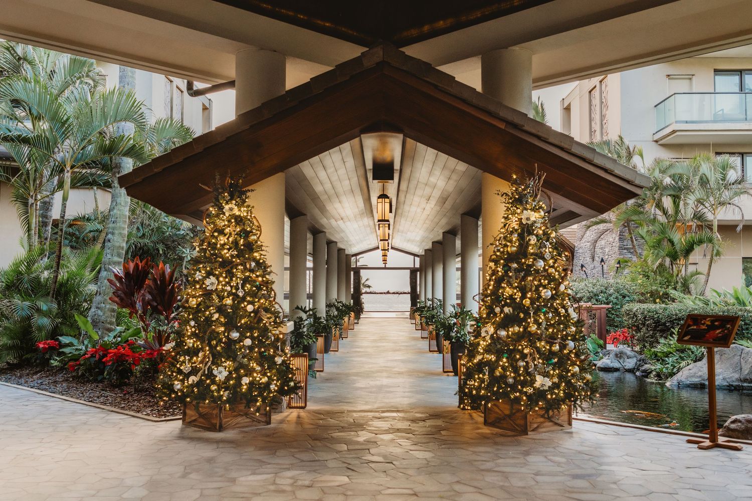 Luxury hotel adorned with Christmas decorations for the holidays. Maui hotel sign with Christmas decorations