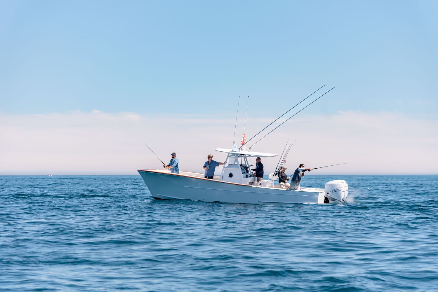 Fishing boat cruising through the ocean waters.