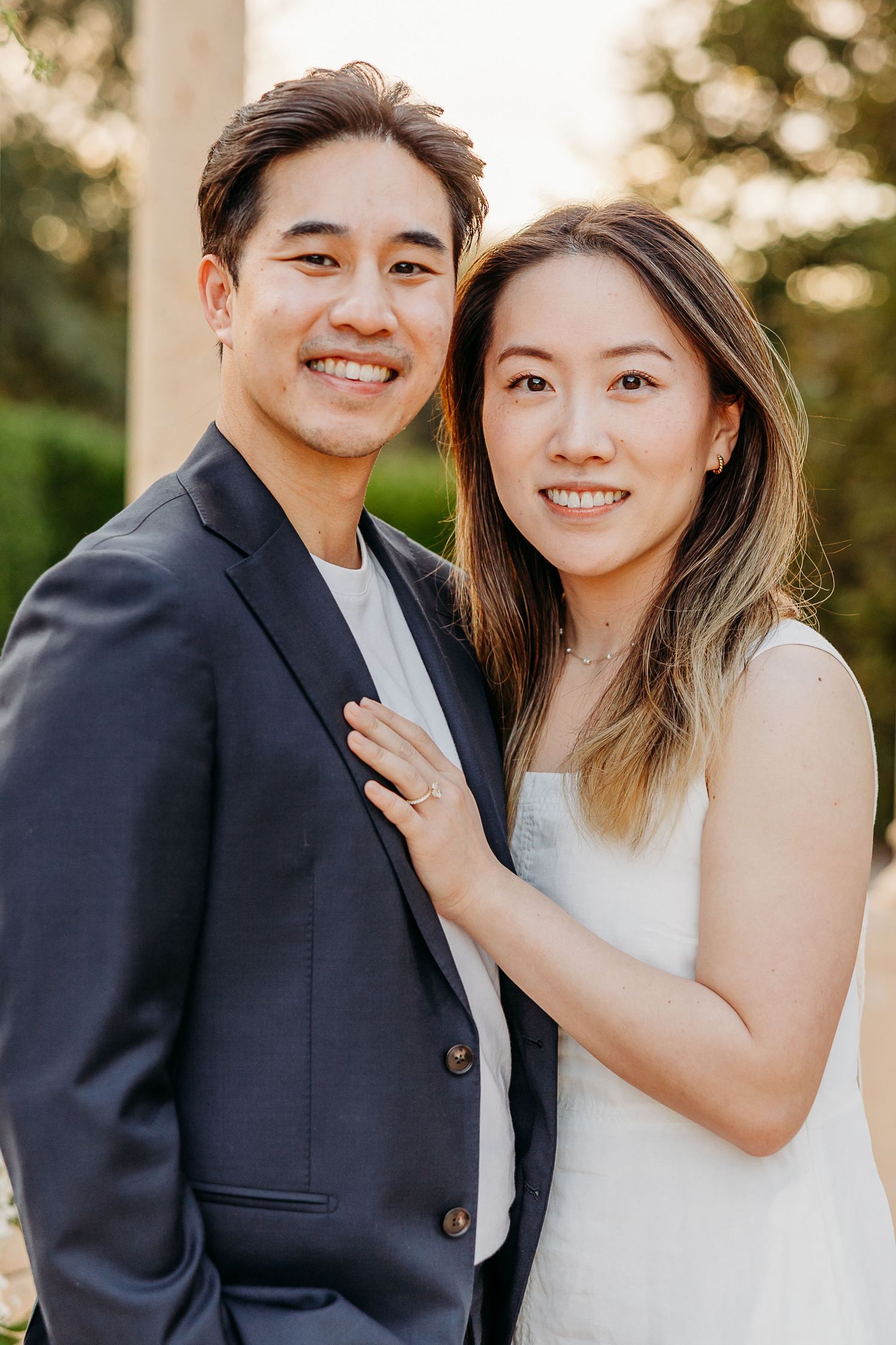 Couple portraits under the floral gazebo at Allegretto Vineyard Resort