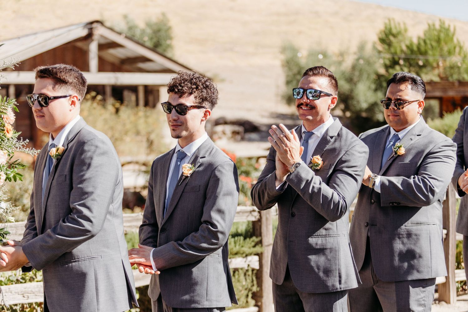 A sequence of candid moments between two people in formal attire interacting and laughing together outdoors.