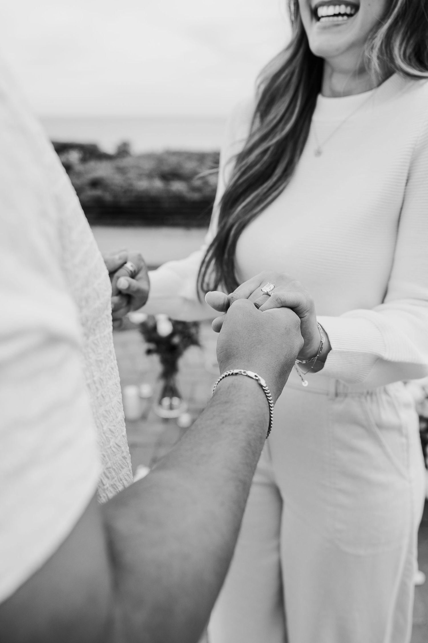 Black and white photo series showing close-up details of a wedding dress with lace and jewelry details.