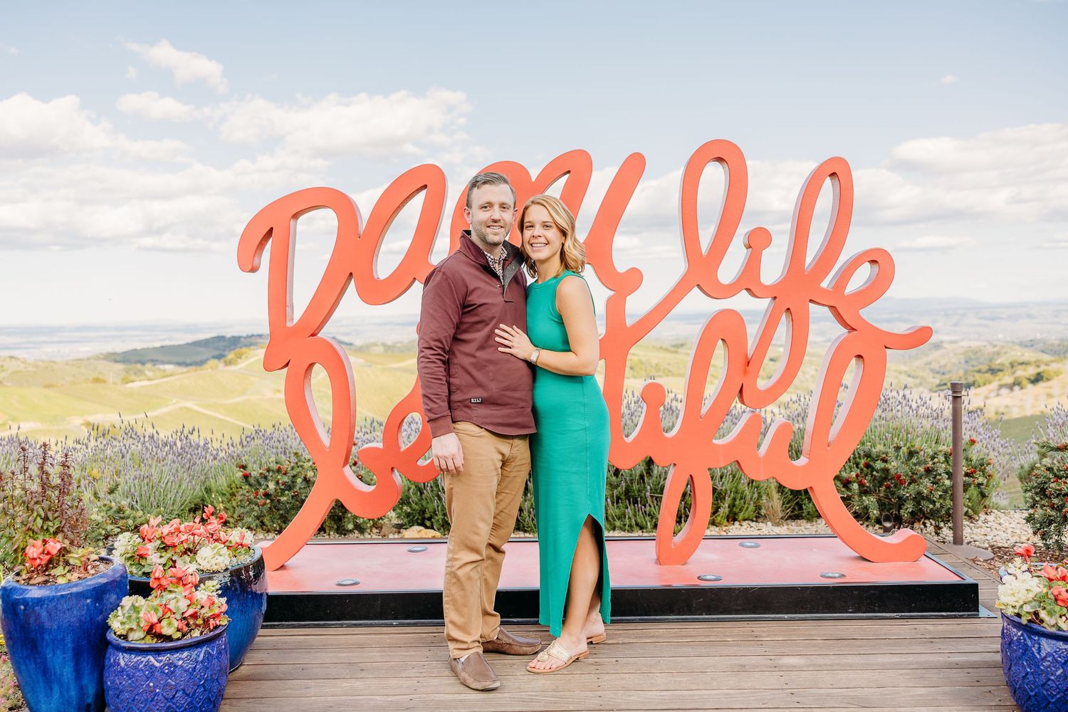 A series of outdoor photos showing a scenic mountain backdrop with bright coral-colored signage against the landscape.
