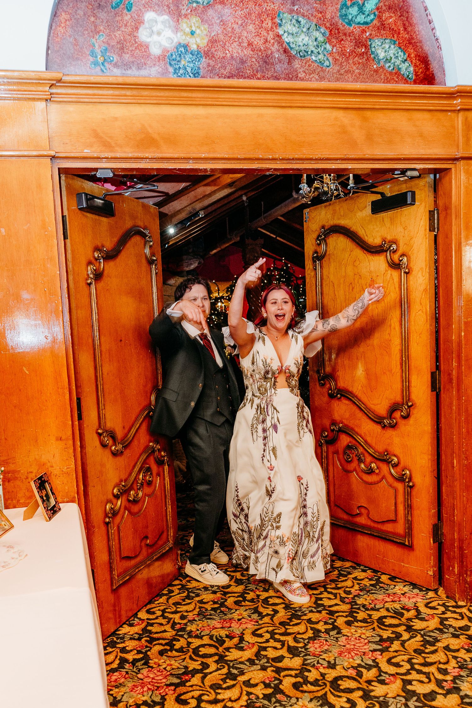 Celebratory moments captured in an ornate wood-paneled room with decorative walls.