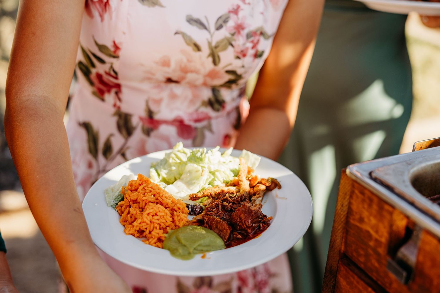 Close-up shots of colorful wedding reception food being served on plates.