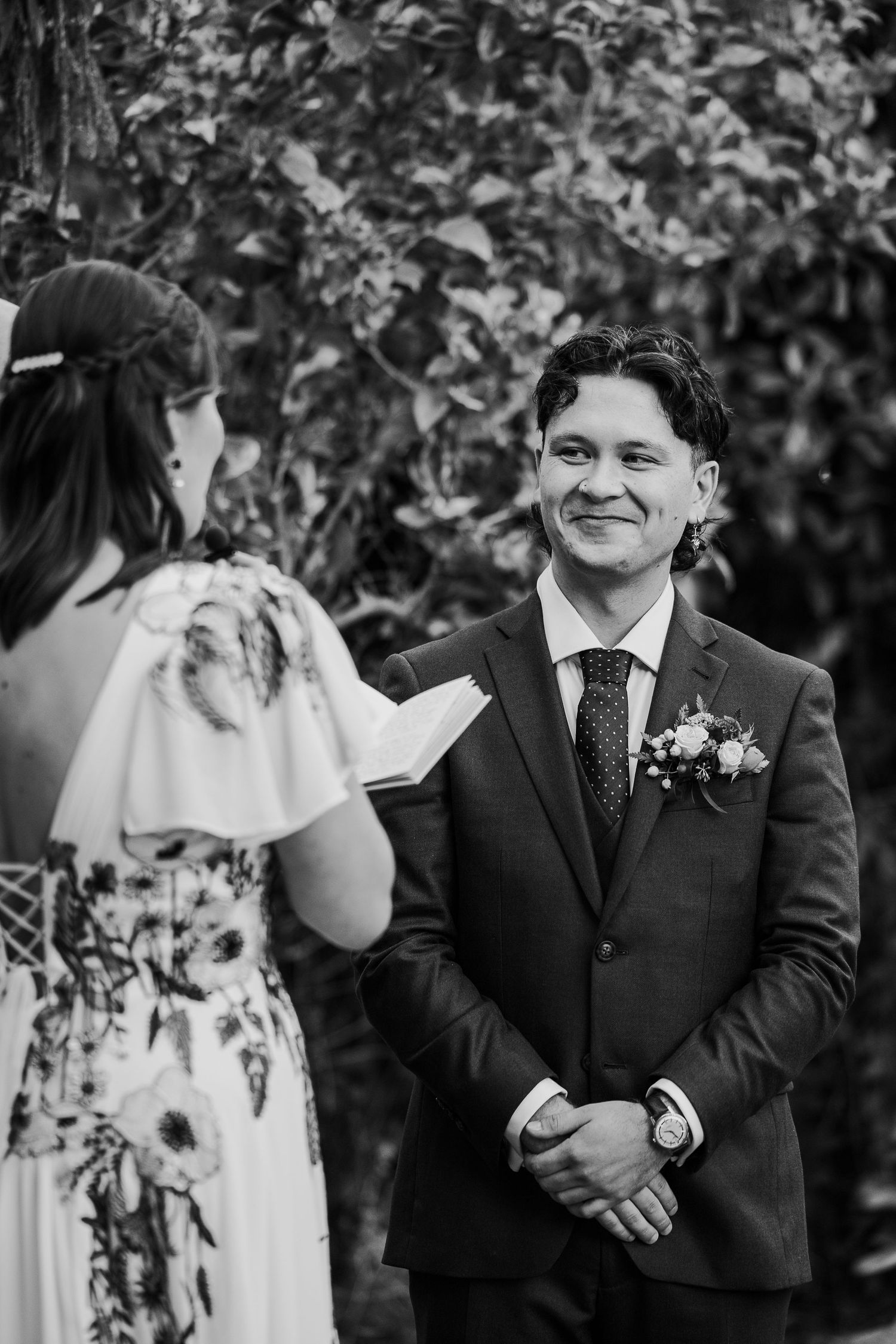 Series of emotional reactions during outdoor wedding ceremony under leafy trees.