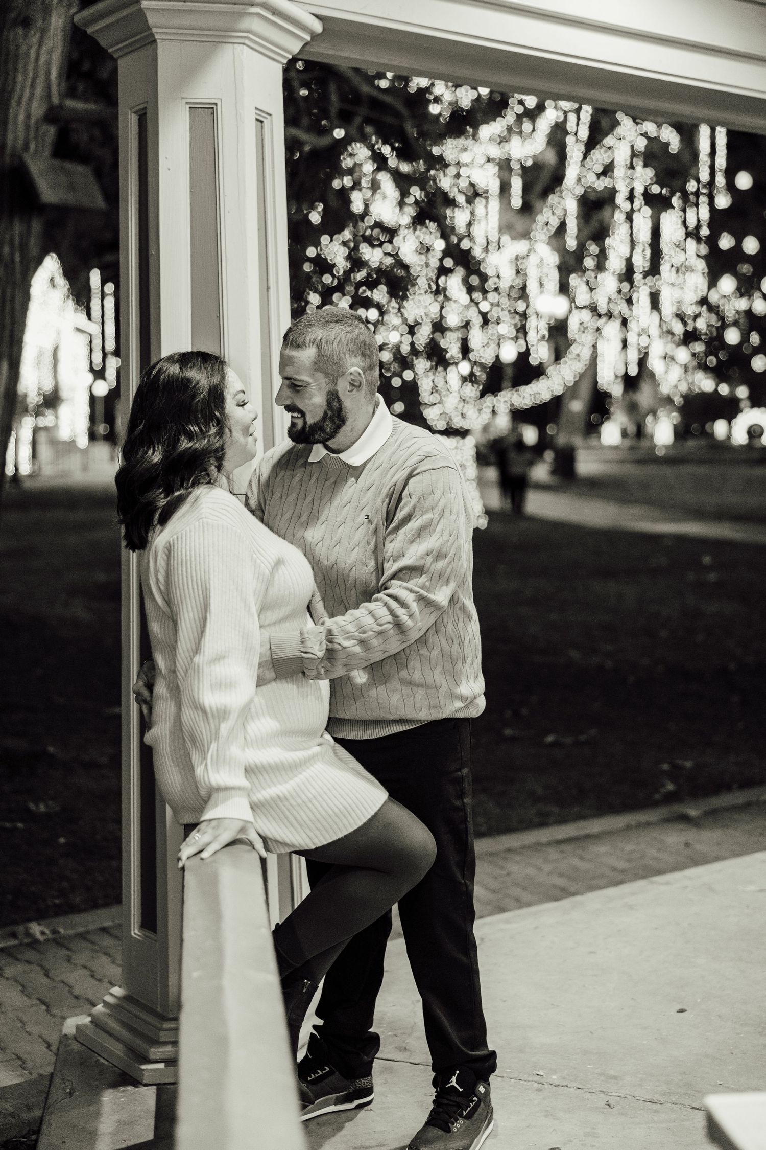 A black and white photo sequence shows a couple dancing playfully on a sidewalk in vintage style clothing.