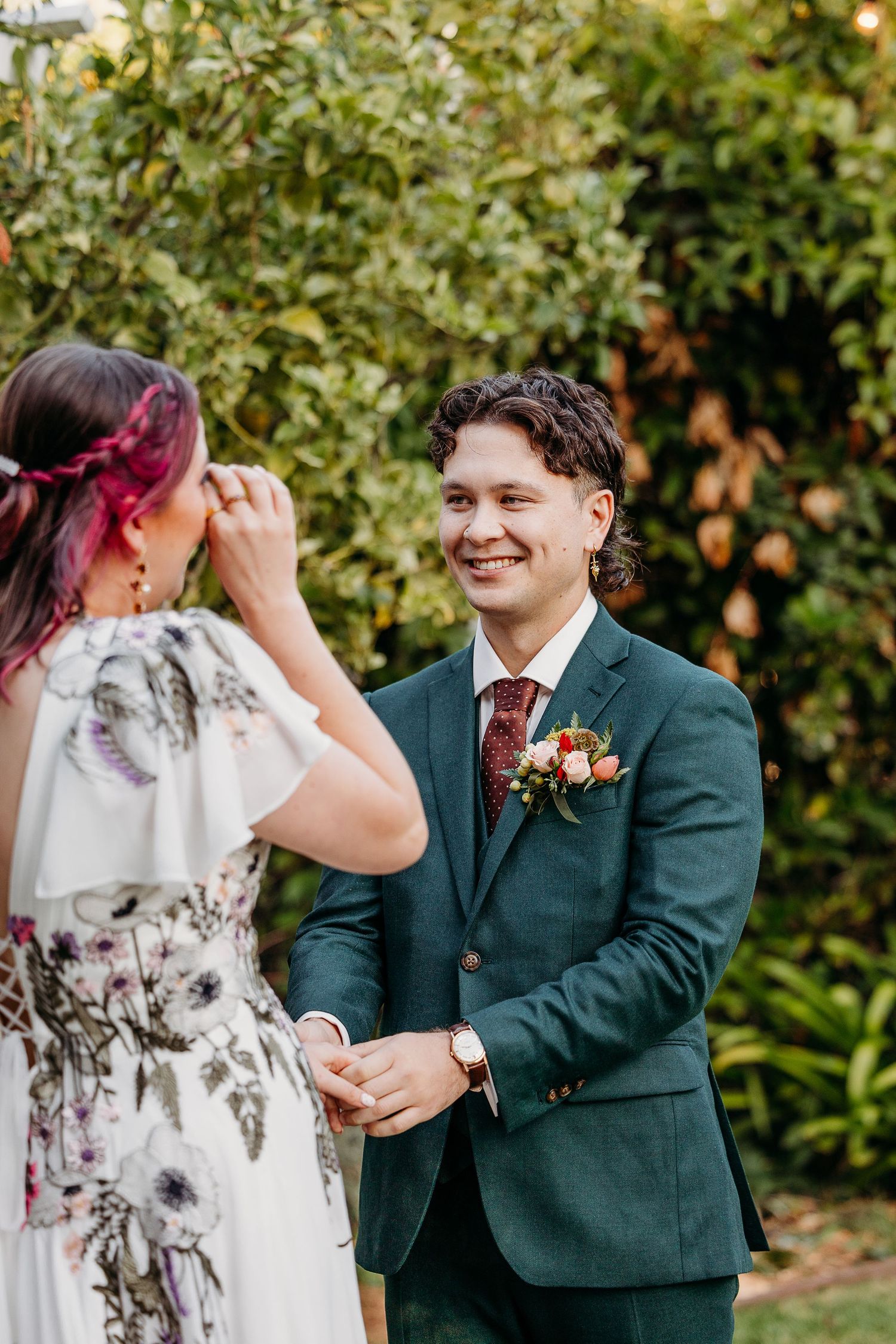 Wedding ceremony moments captured in garden setting with floral details.