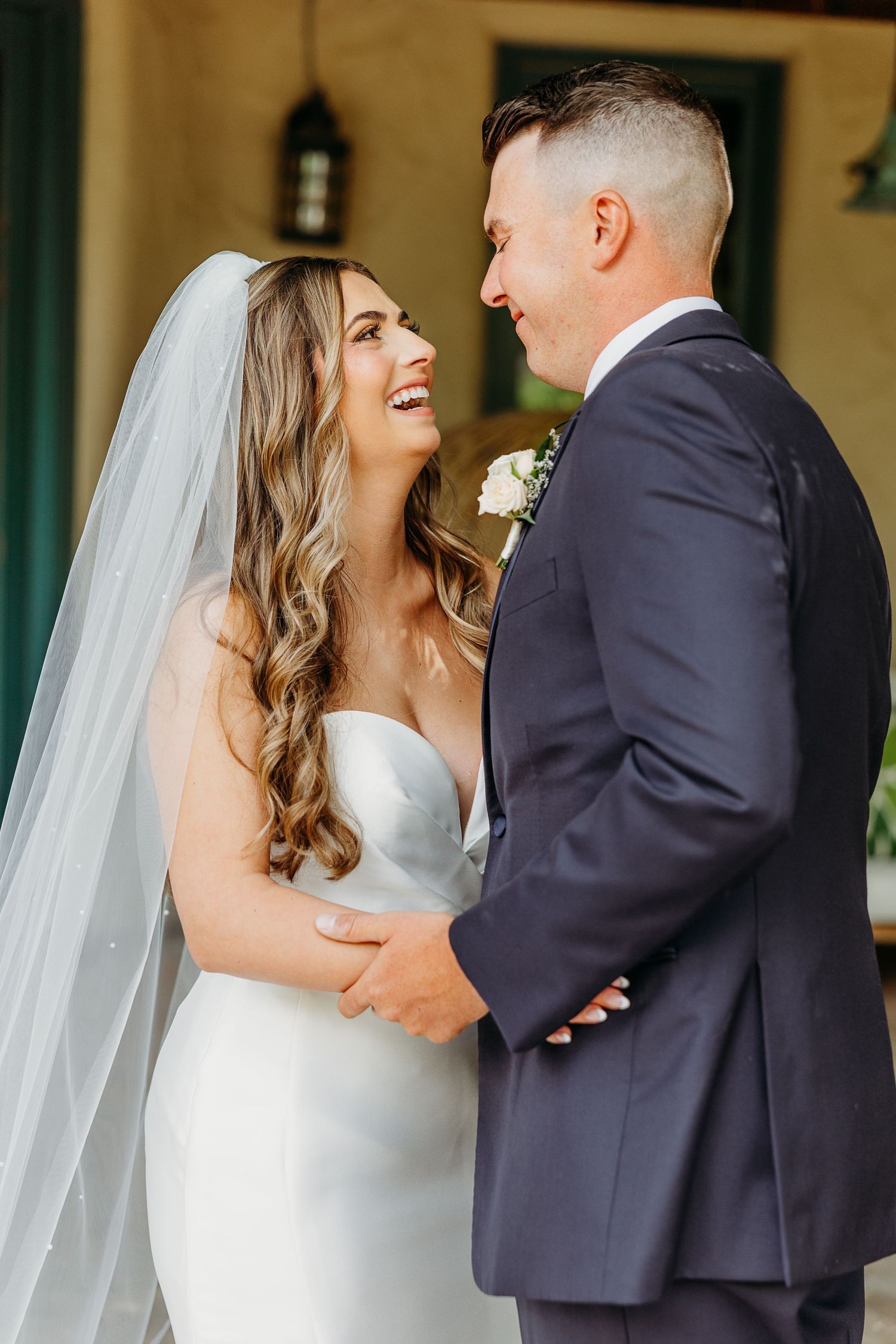 A touching first look wedding moment between bride and groom outdoors in four captured stages of emotion.