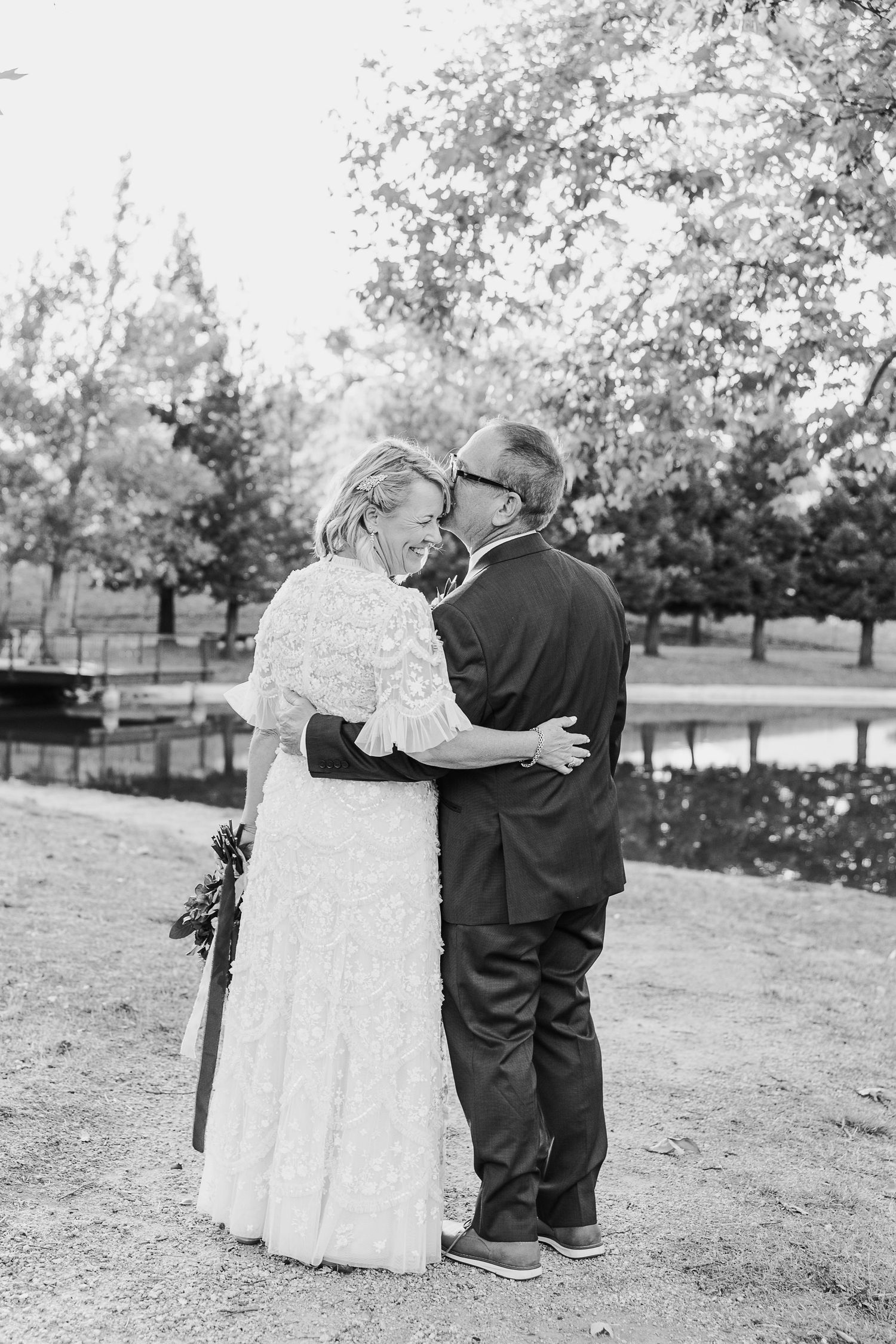 Black and white wedding portraits captured in a scenic outdoor setting.