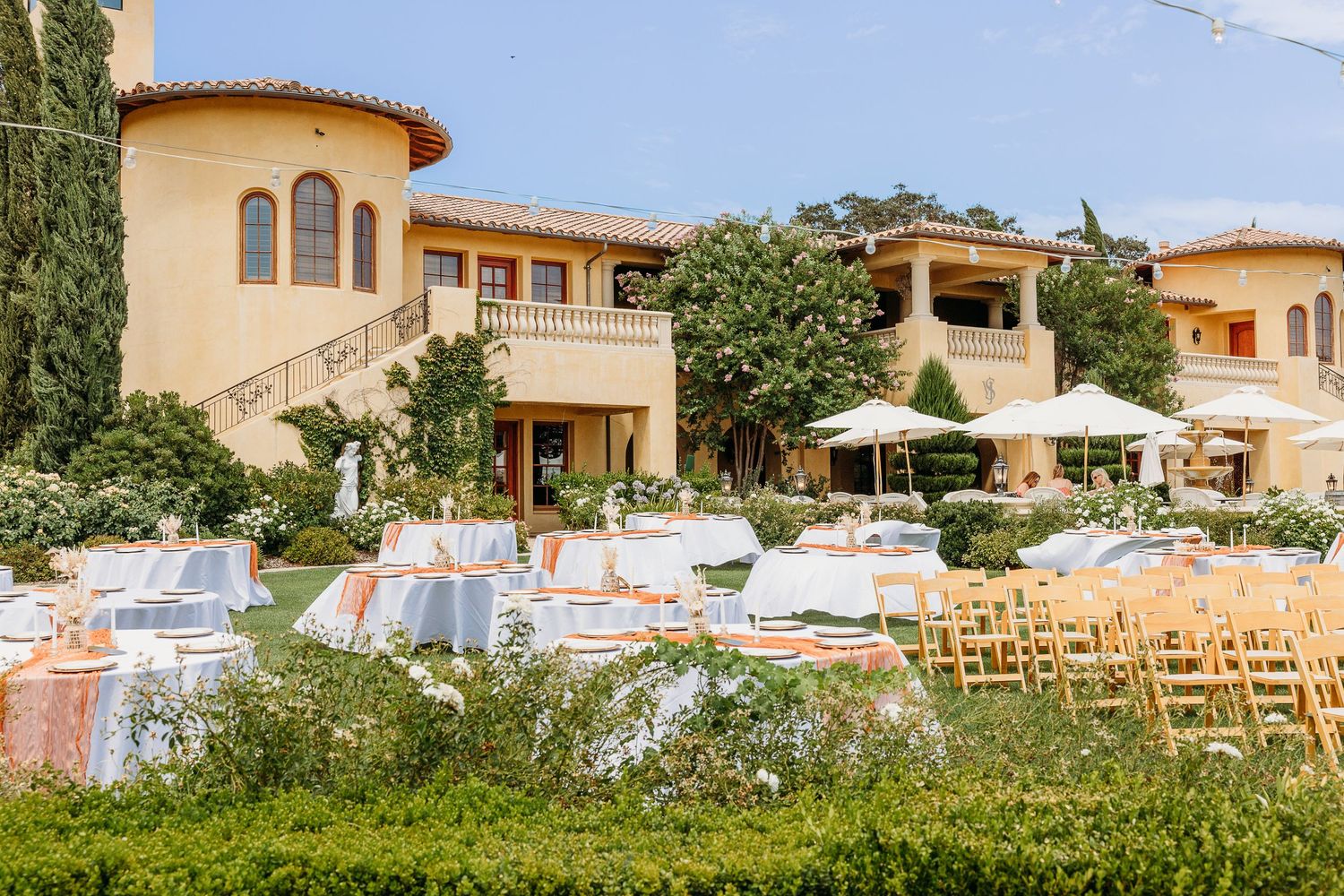 Mediterranean style wedding venue with outdoor reception setup and mountain views.