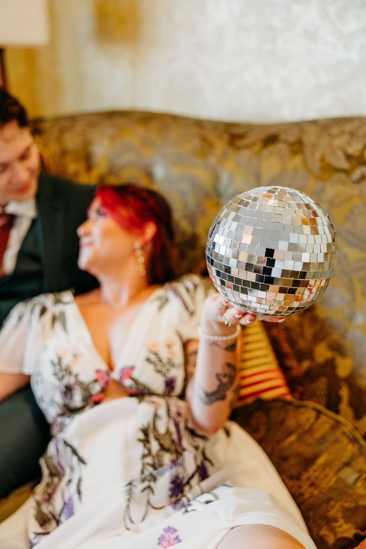 A creative photo series showing a disco ball appearing to float above a person's head in a vintage-style setting.
