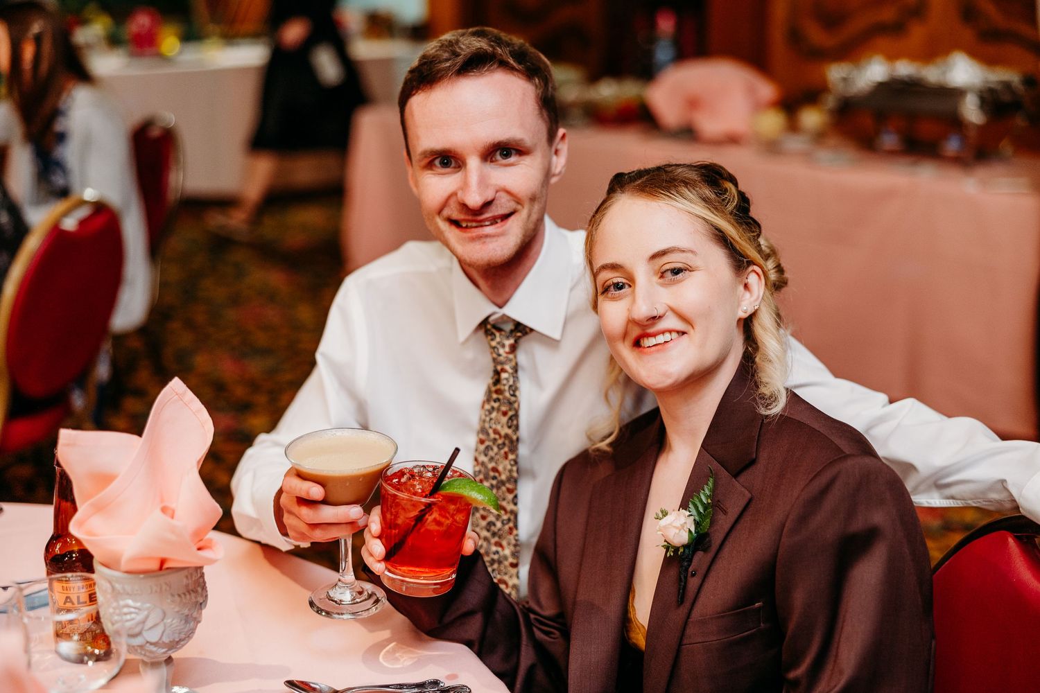 Wedding reception candid moments captured in warm lighting.