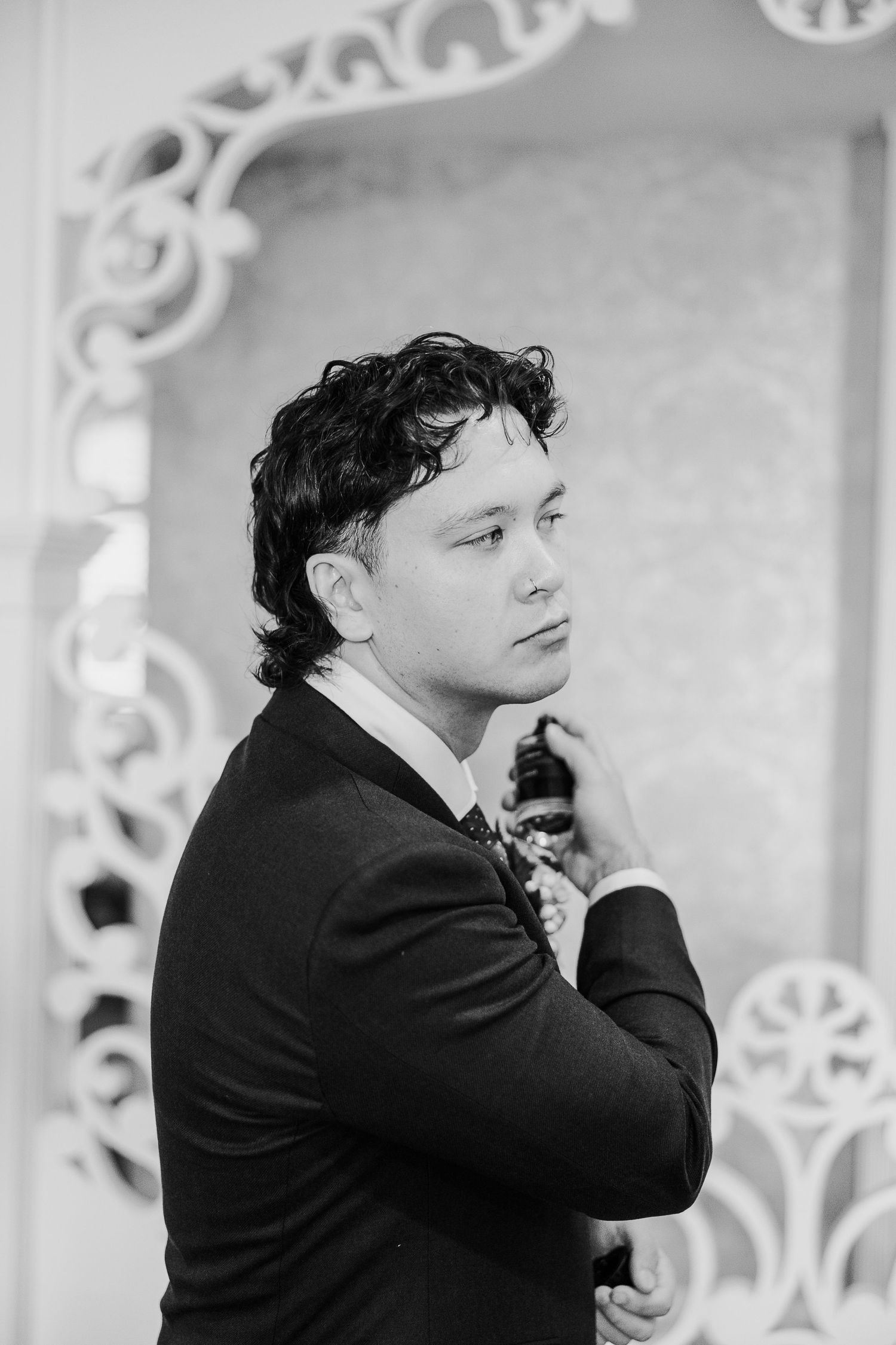 Black and white portraits showing emotional moments through ornate white archways.