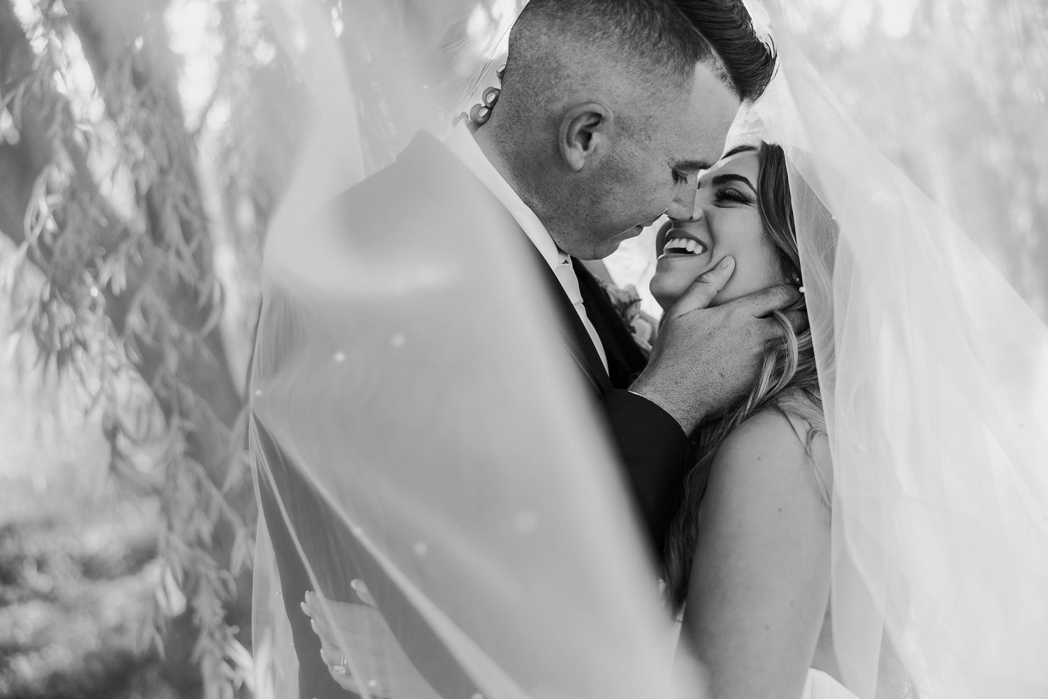 Wedding couple shares intimate moments through a romantic black and white photo series.