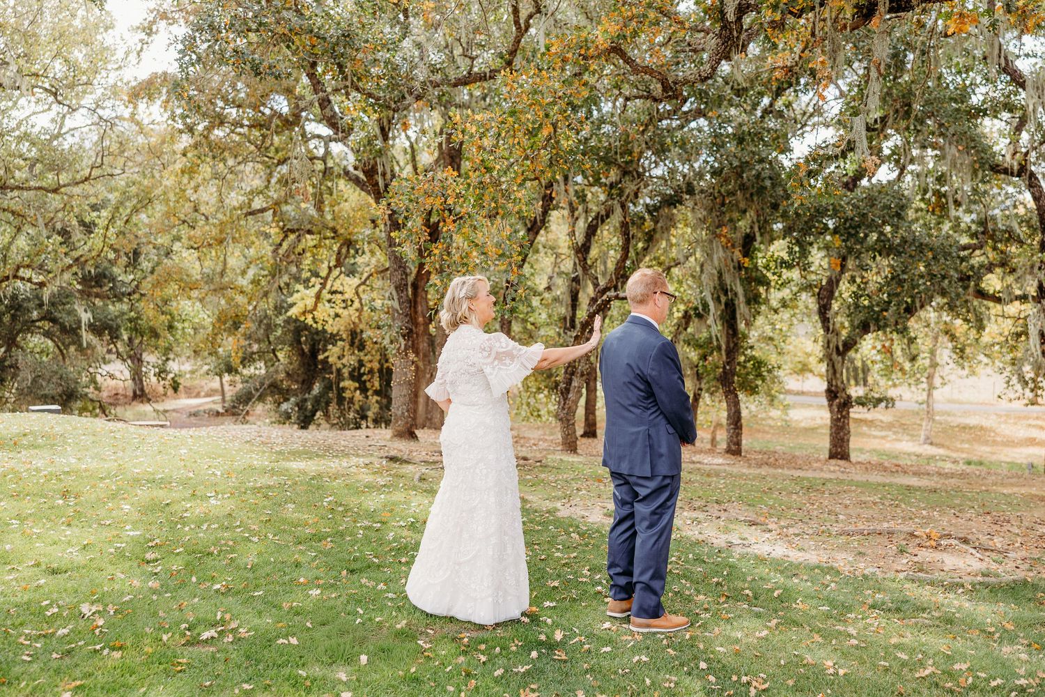 Outdoor wedding ceremony captured in sequence on a grassy hill with autumn trees.