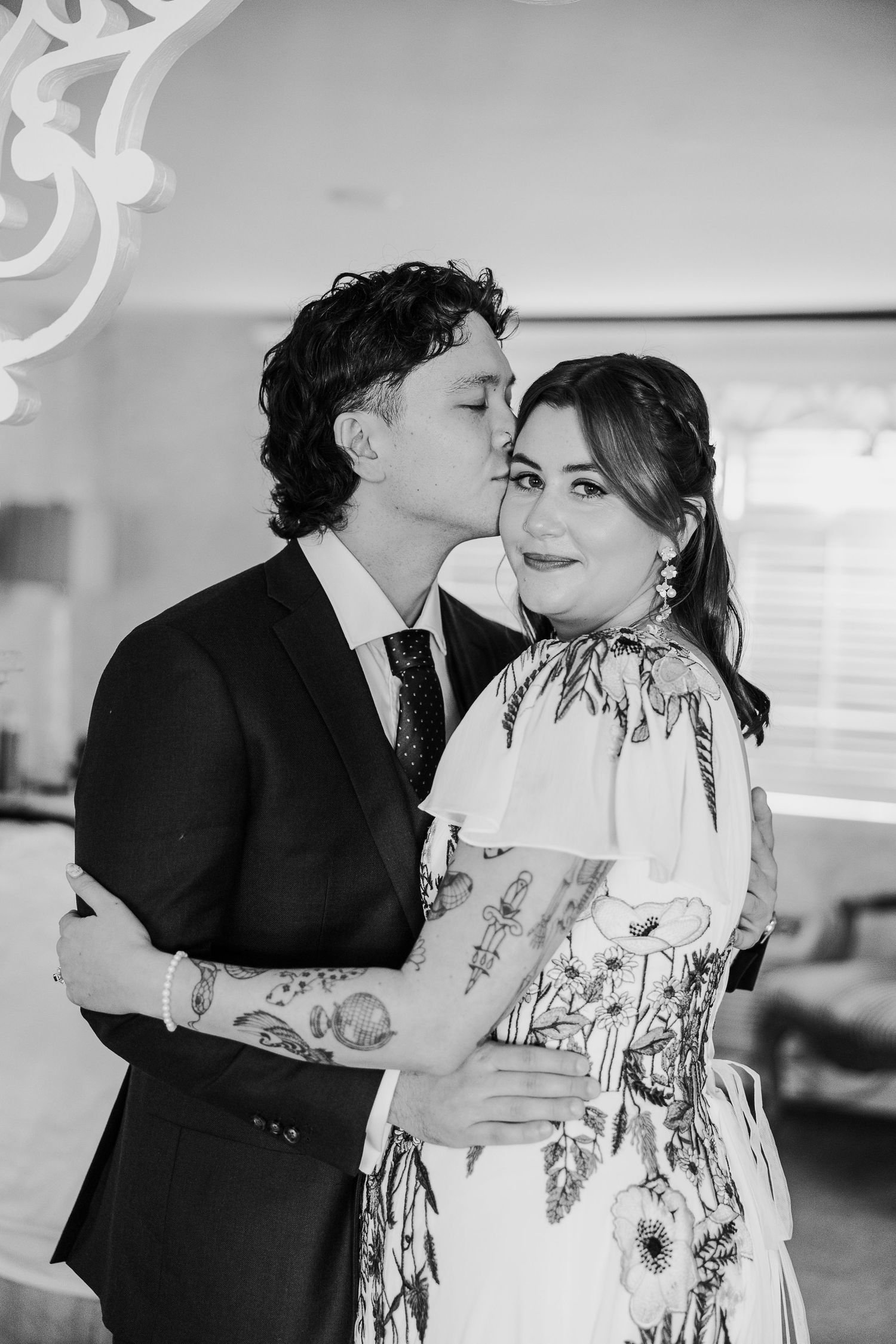 A series of romantic moments showing a couple embracing and sharing tender kisses in a bright indoor setting.