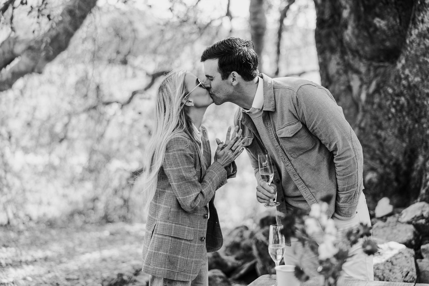 Black and white photo series capturing joyful moments between a couple.