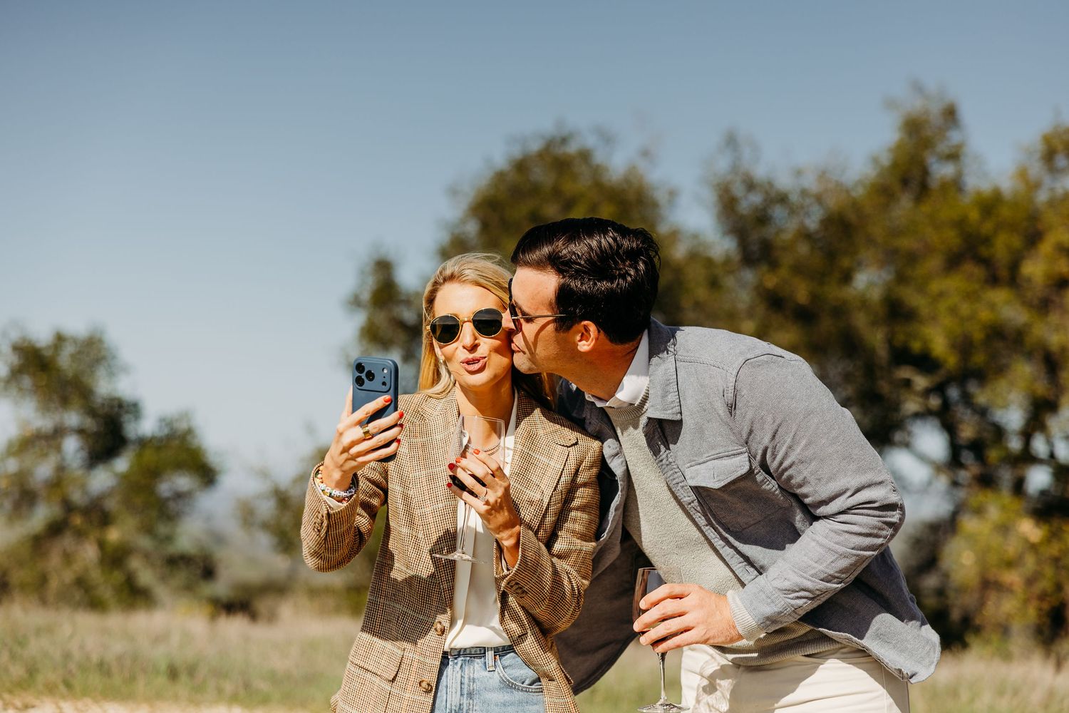 A romantic celebration moment captured in a scenic outdoor setting.