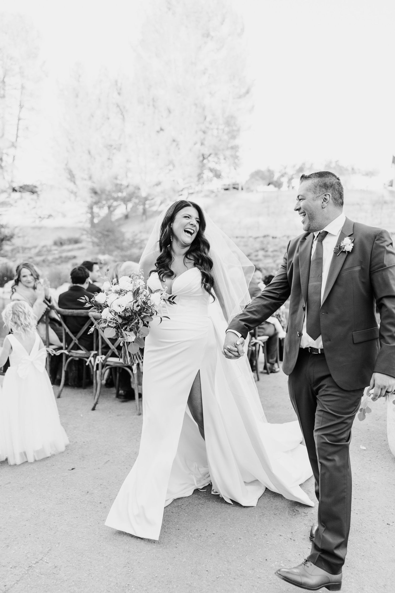 Black and white photos show joyful wedding party dancing outdoors at reception celebration.