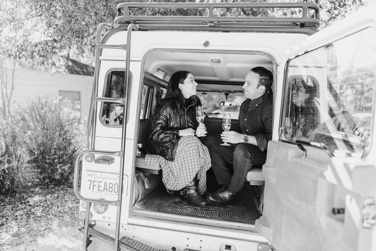 A series of vintage black and white photographs showing people loading and unloading items from delivery vans.