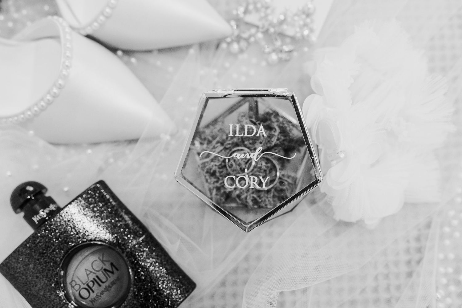 Vintage perfume bottles and crystal decanters arranged in an elegant black and white composition.