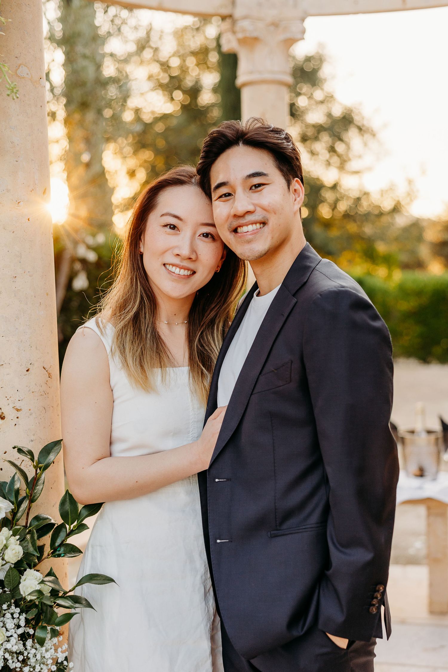 Joyful couple shares intimate moments together during outdoor engagement session.