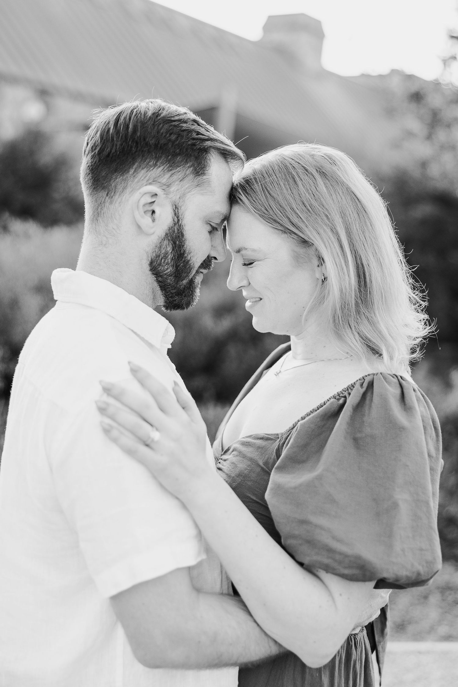 Black and white romantic couple portraits showing intimate moments and tender embraces.