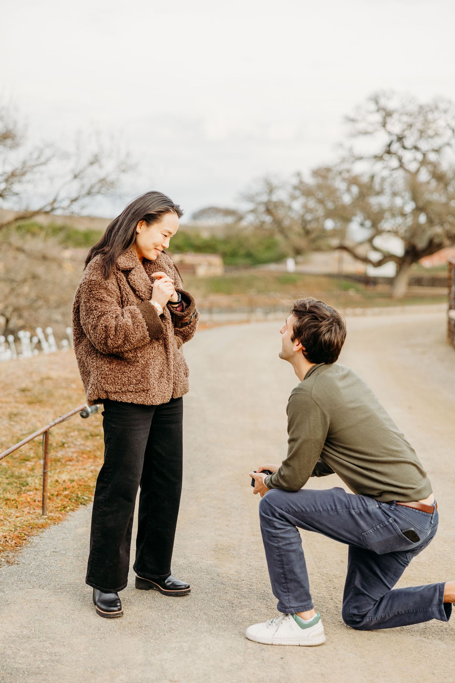A sequence of proposal photos showing someone kneeling down on a path outdoors.