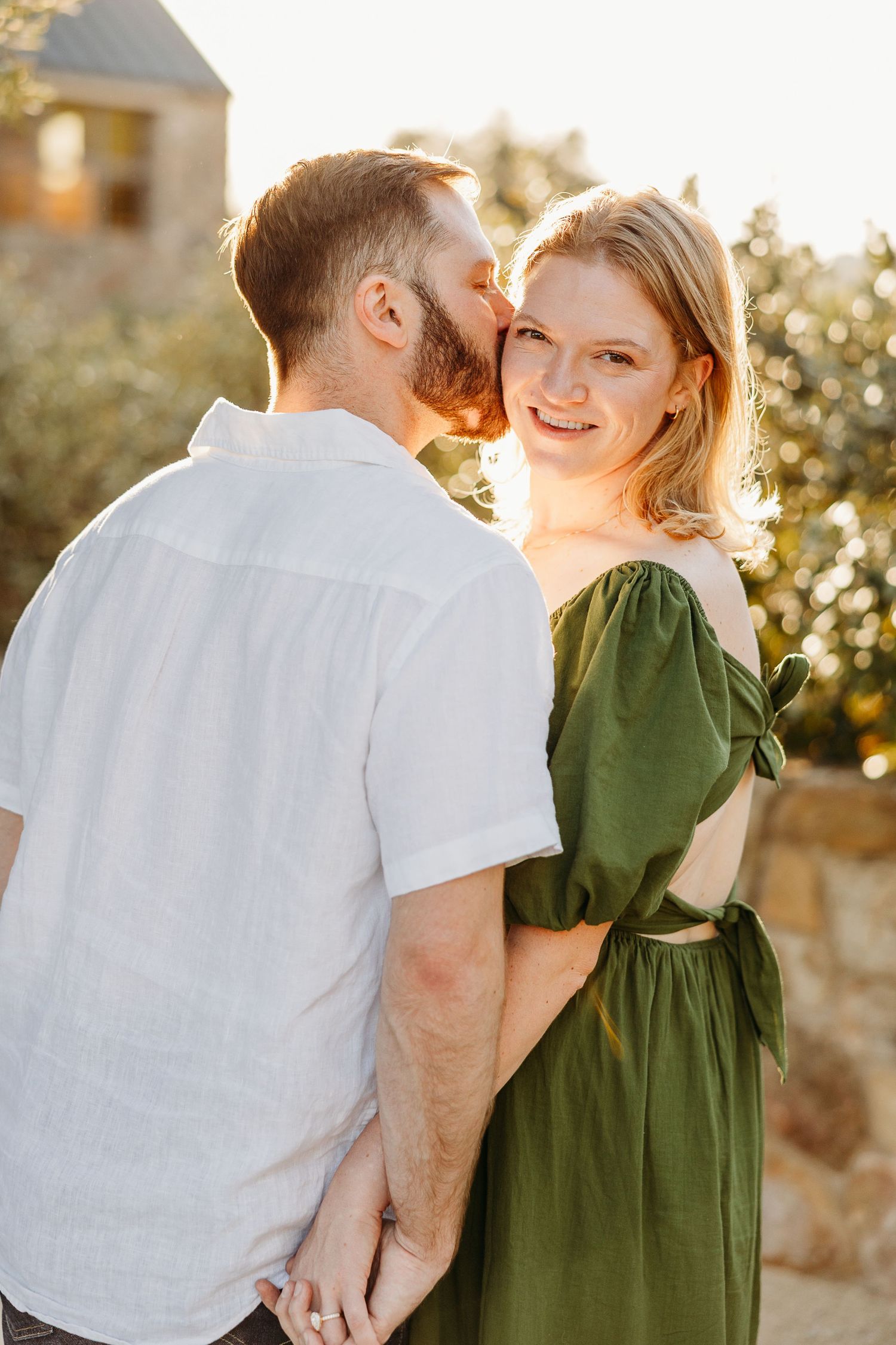 Candid engagement photography series showing couple embracing in natural outdoor setting.