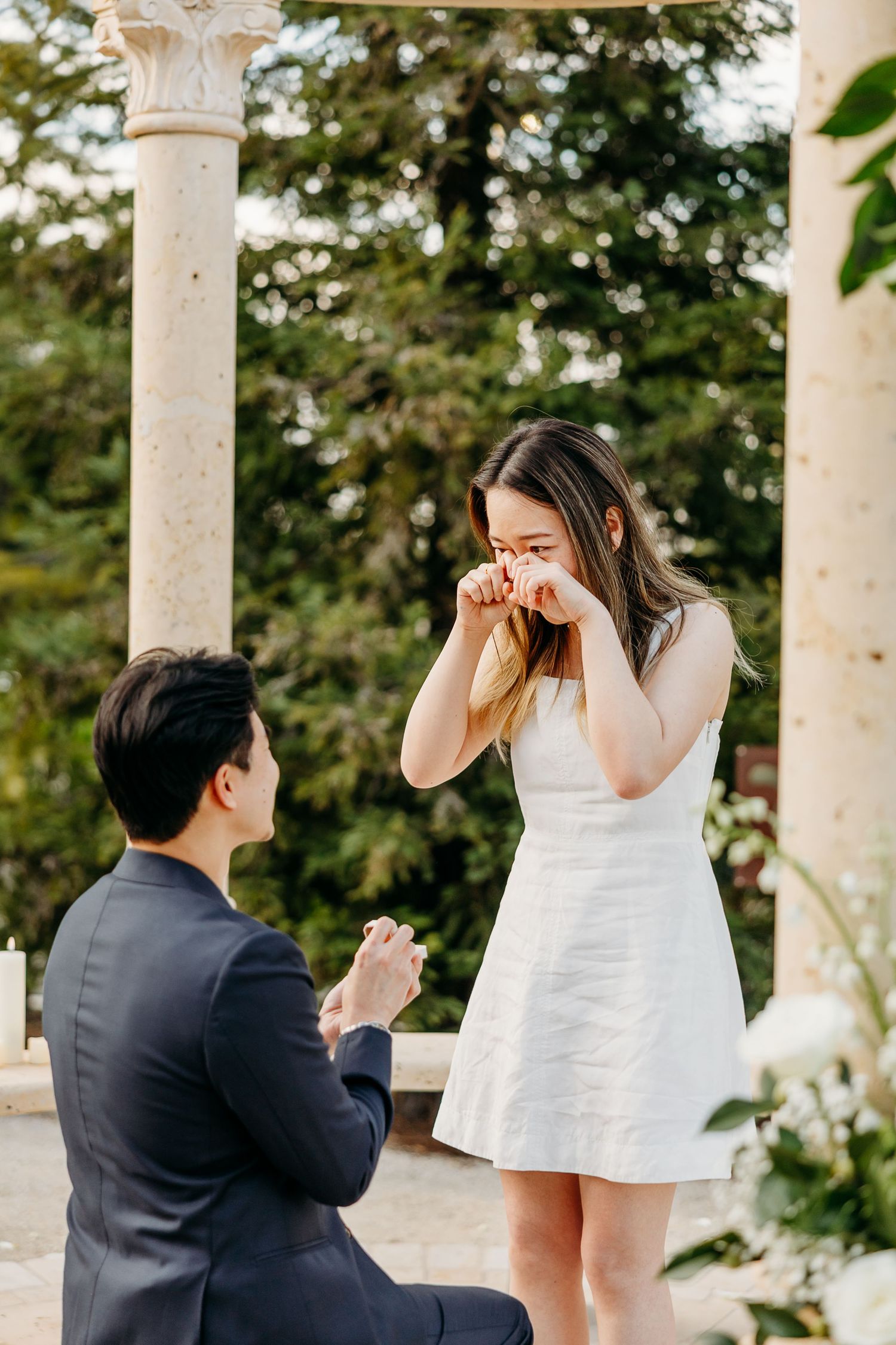 Surprise proposal moment in the garden at Allegretto Vineyard Resort in Paso Robles