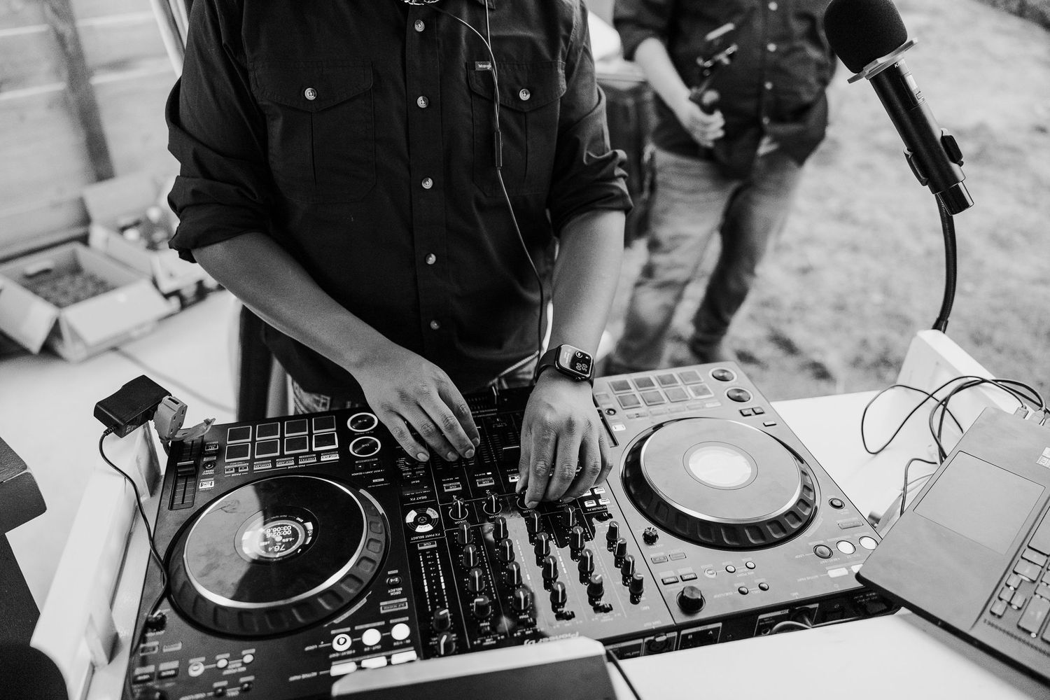 DJ equipment setup with turntables and mixer at wedding reception.