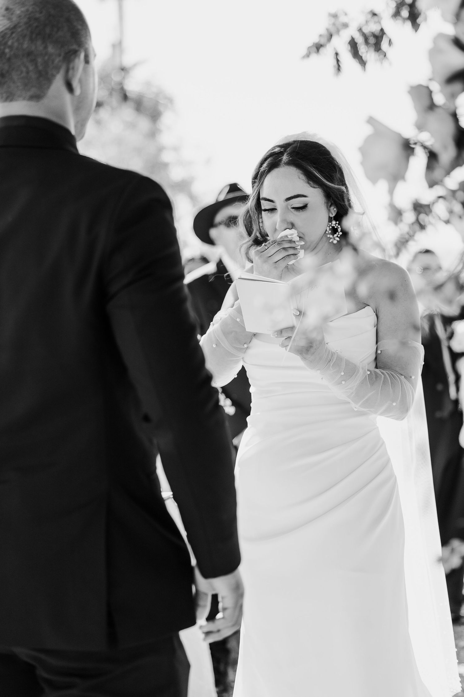Black and white sequence of wedding ceremony moments outdoors.