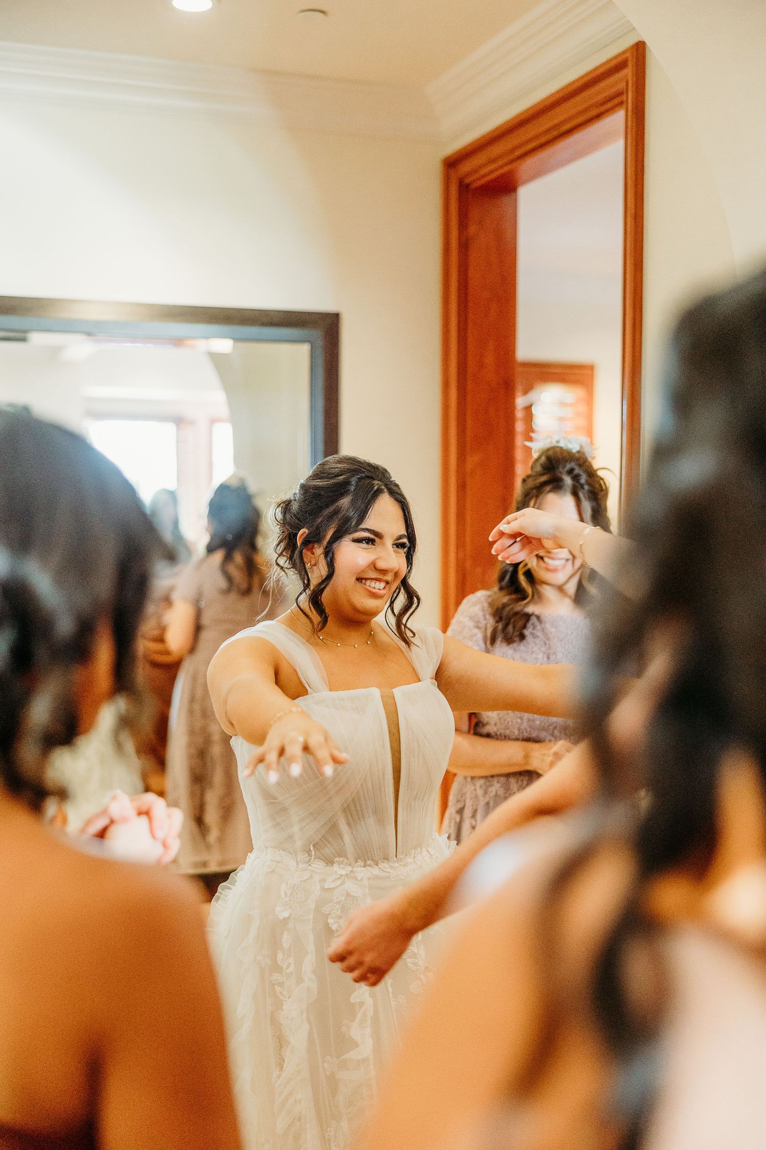 A candid moment of celebration and excitement captured in warm natural light with wooden accents.