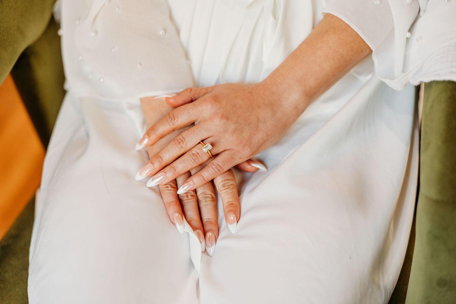 Multiple hands holding white coffee cups in a minimalist style composition.