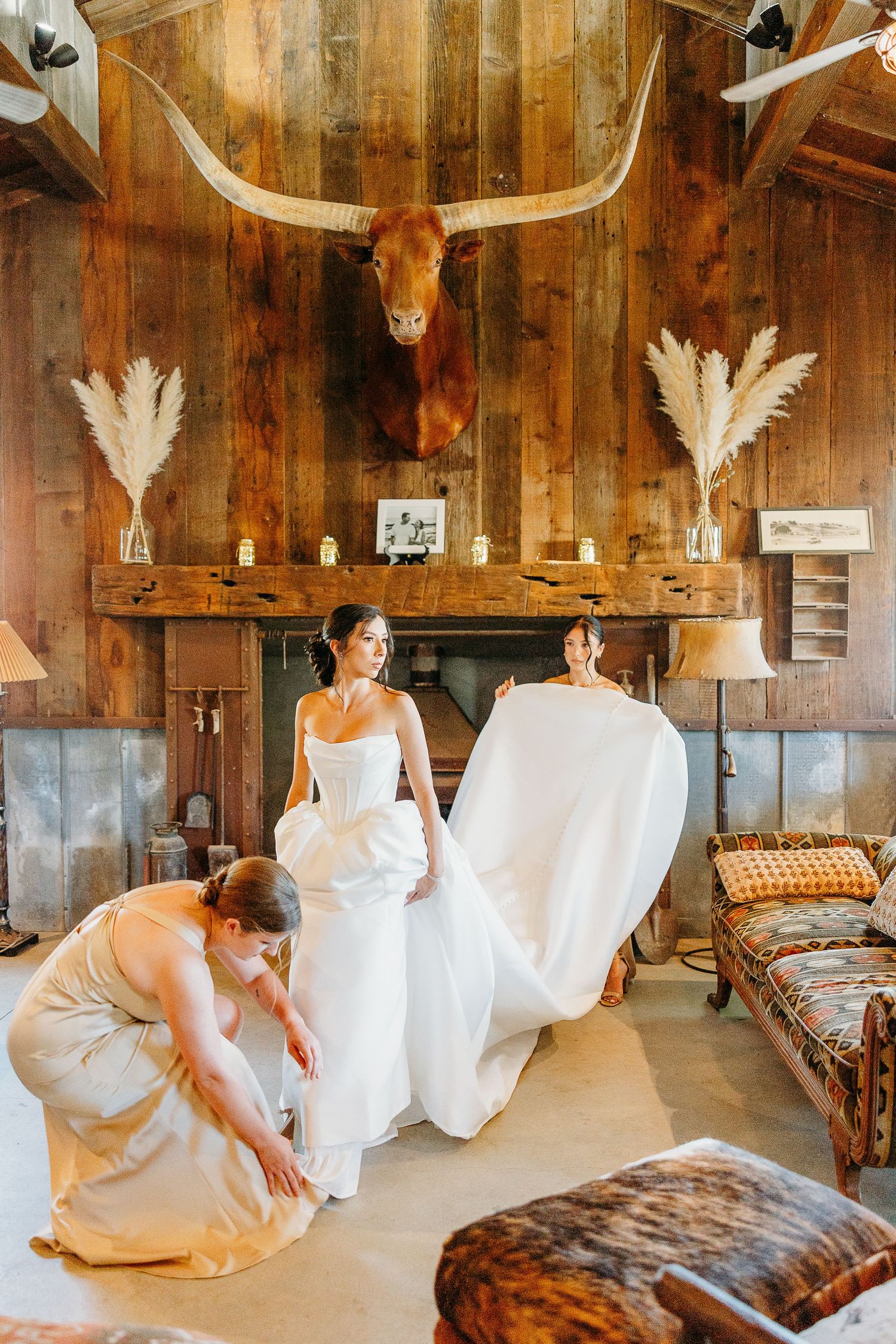 A series of photos showing a rustic barn venue decorated with white chairs and antler decor.