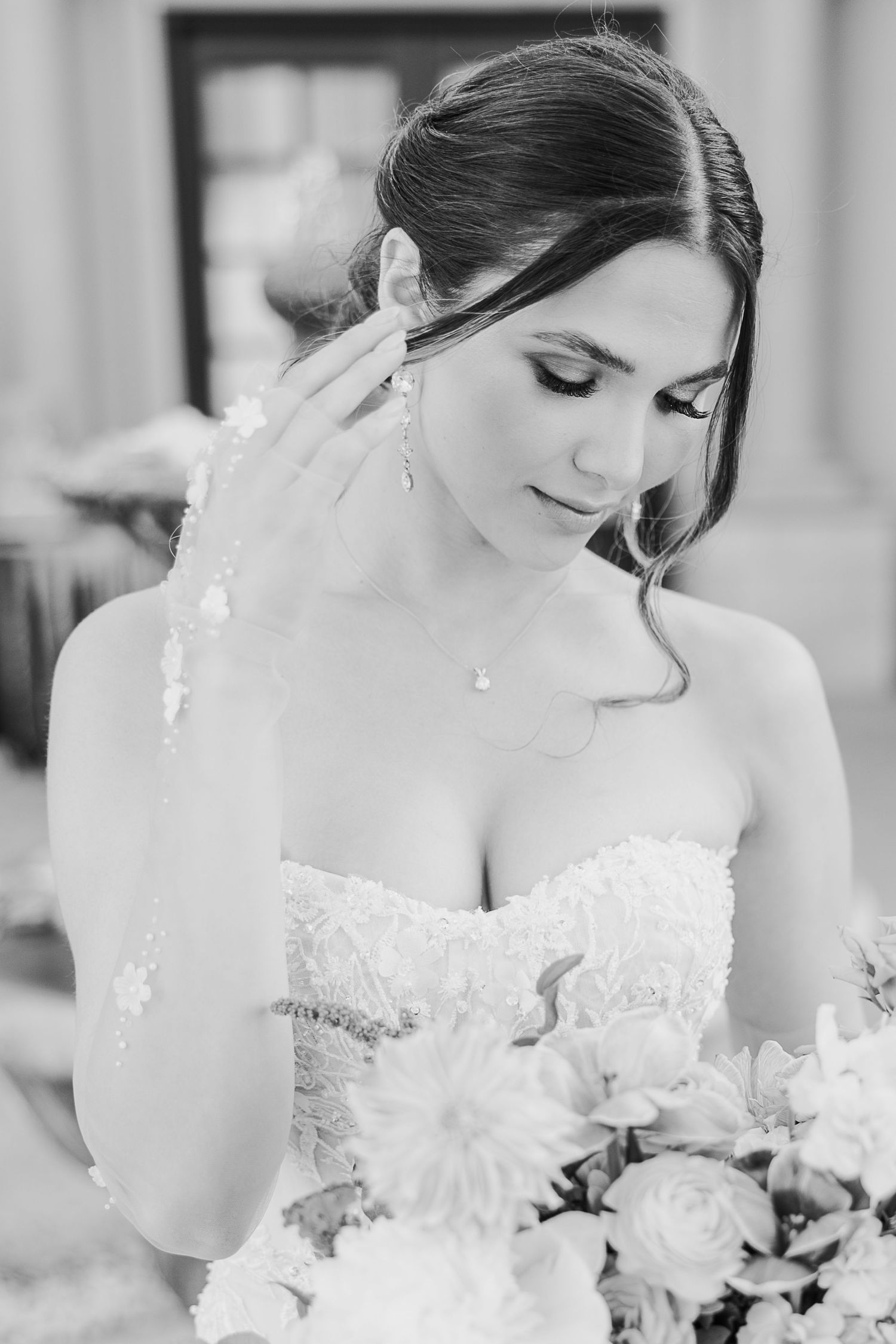 Close-up black and white bridal portraits showing elegant wedding dress details and floral bouquet.