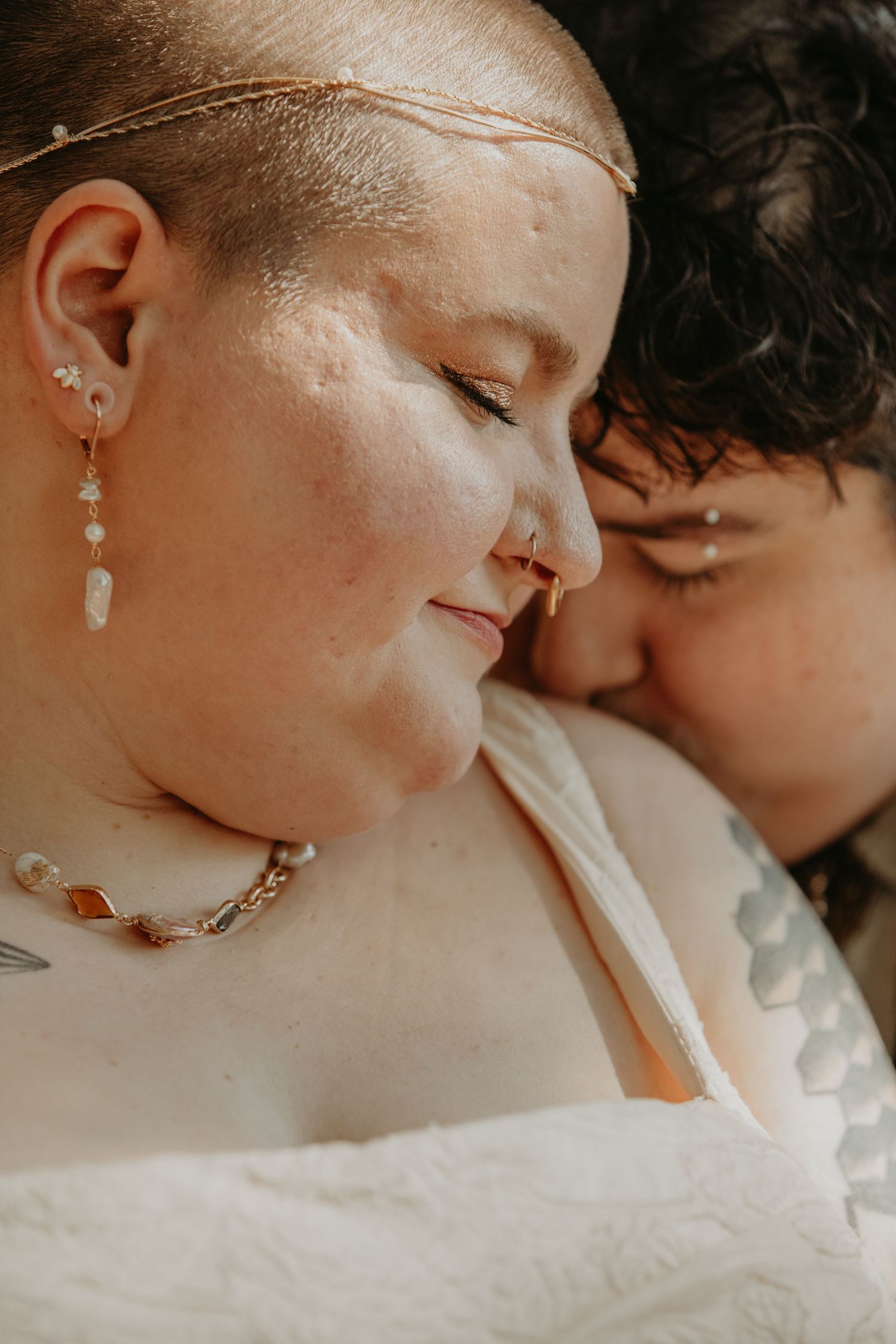 Close-up romantic wedding portrait series showing tender intimate moments between a couple in soft lighting.