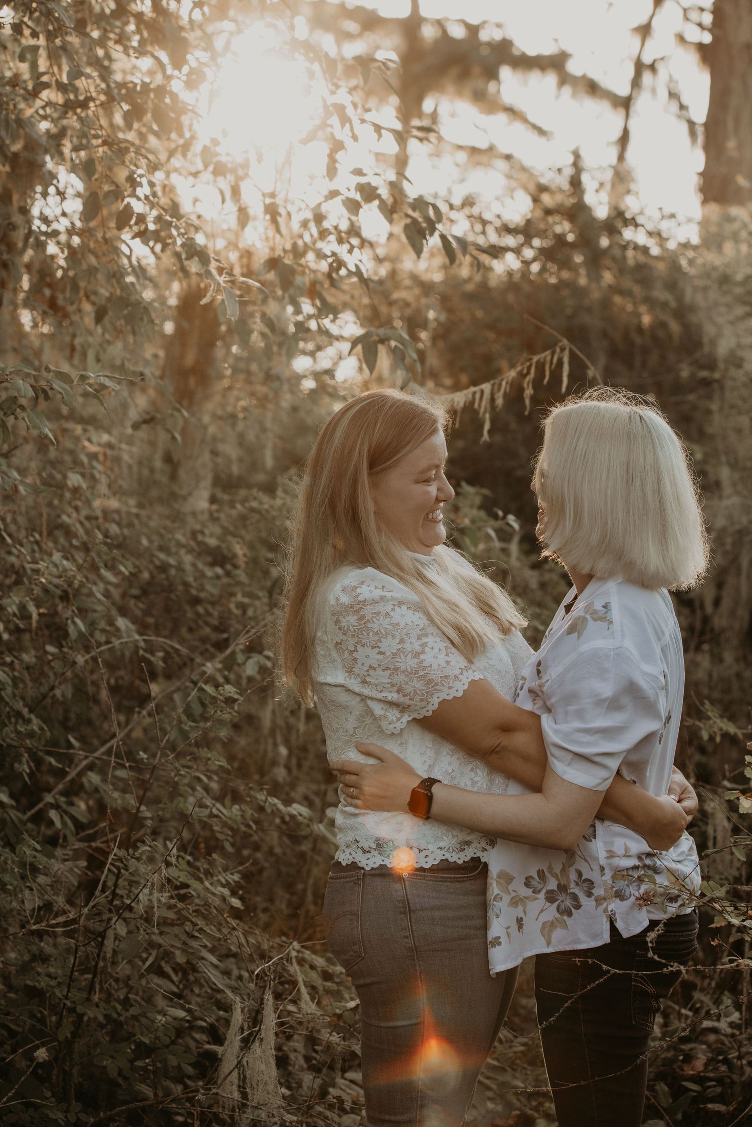 Three intimate photos capture a tender sunset moment between two people embracing in a natural outdoor setting.