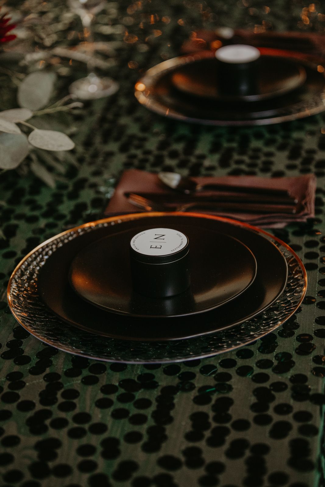 Close-up view of vinyl records arranged on a dark textured surface with hexagonal patterns.