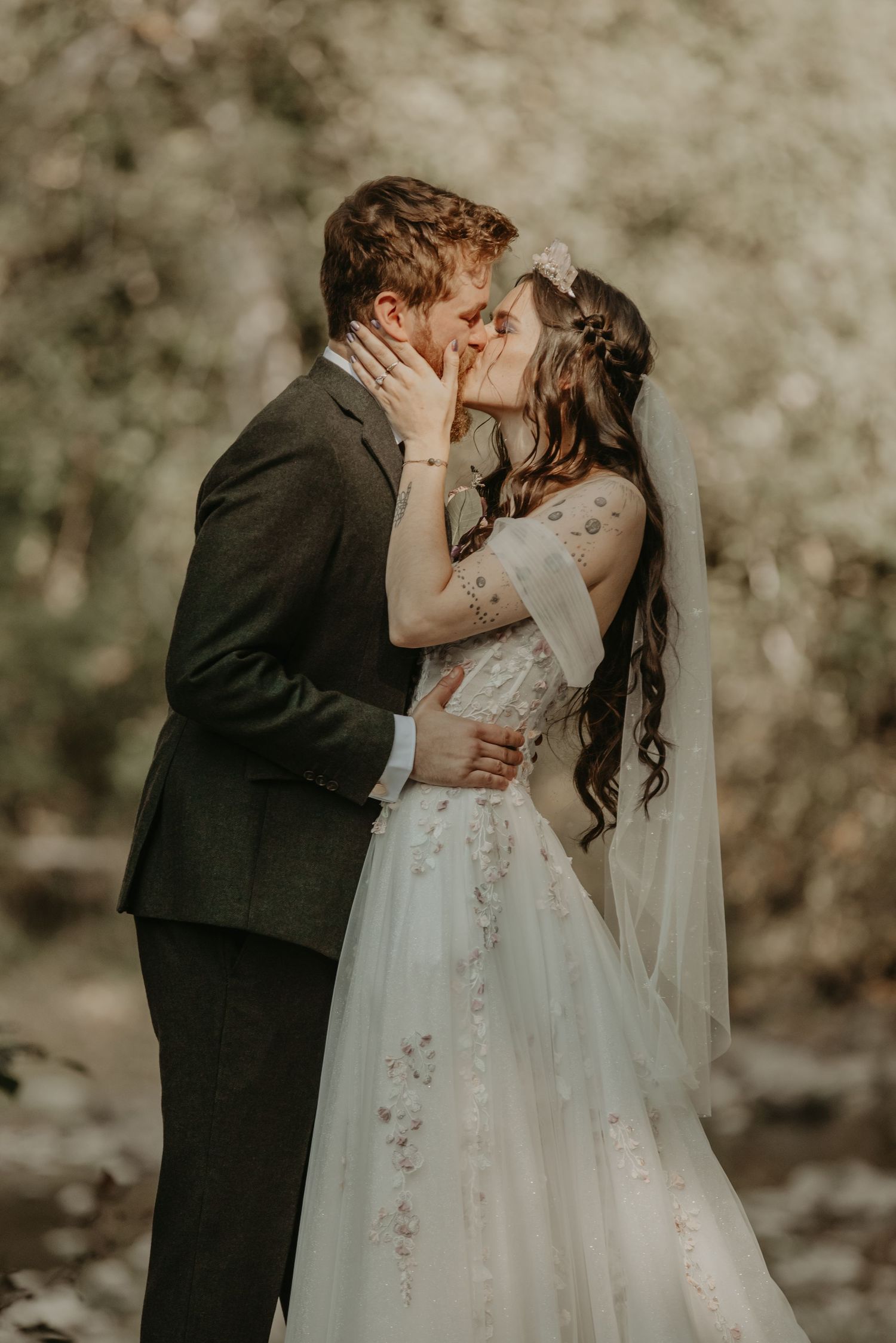 A romantic outdoor wedding scene with a couple embracing in a dreamy, natural setting.
