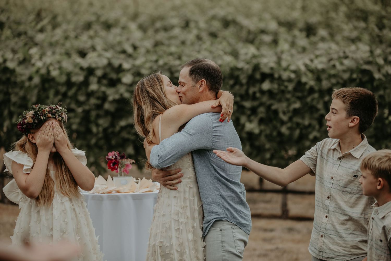 A series of candid outdoor wedding moments showing couples embracing and sharing intimate moments in a natural setting.