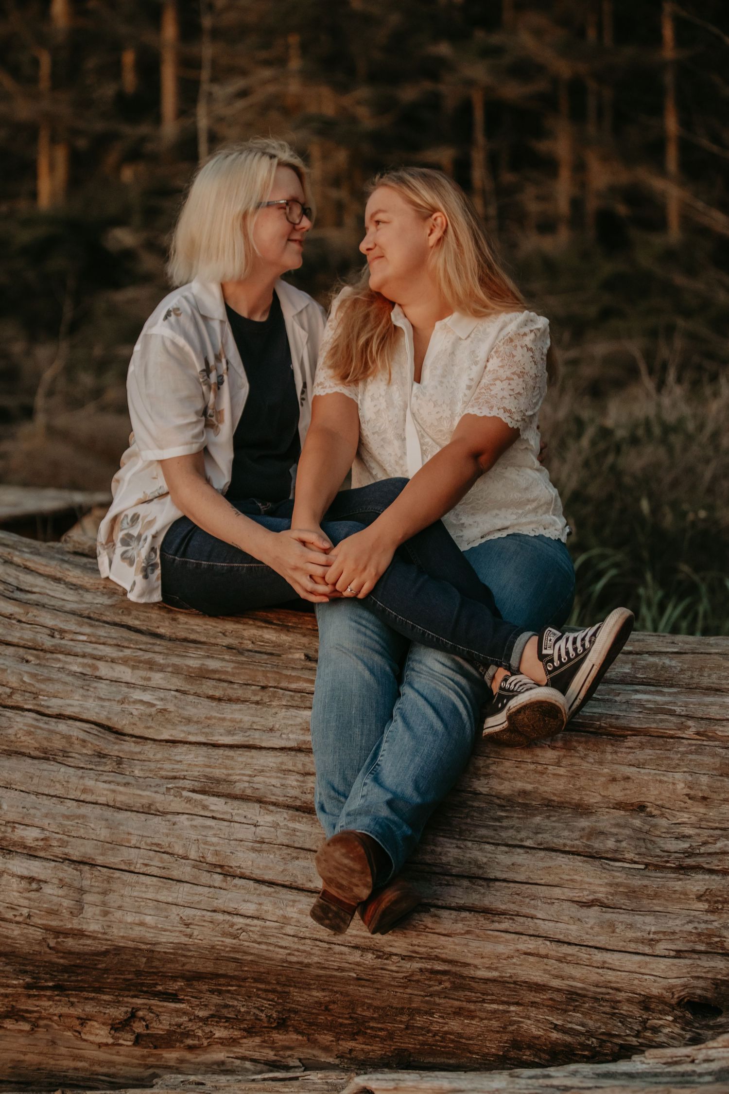 A couple sitting close together on a fallen log in a forest during sunset, captured in multiple candid moments.