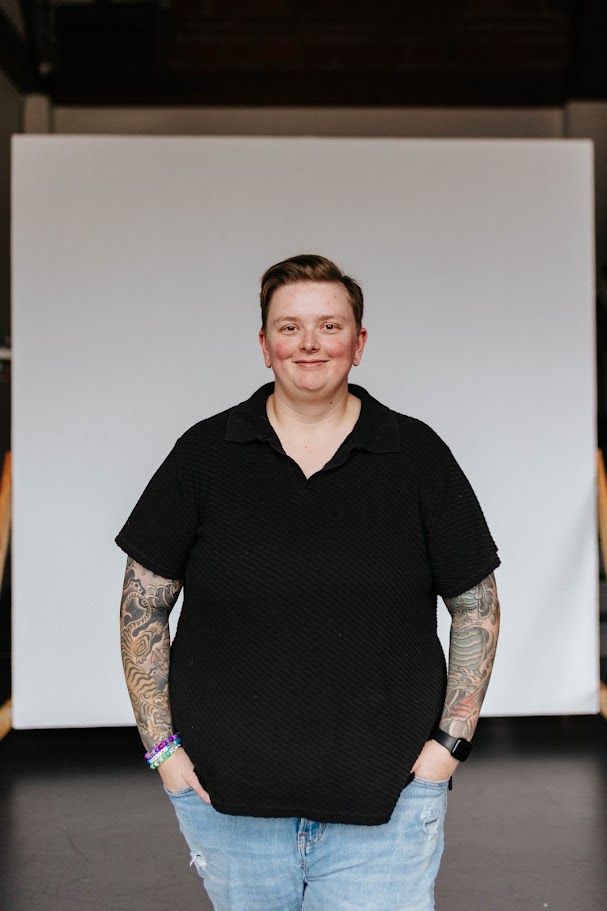 Person wearing black sweater and jeans poses with tattoos against white background in multiple shots.