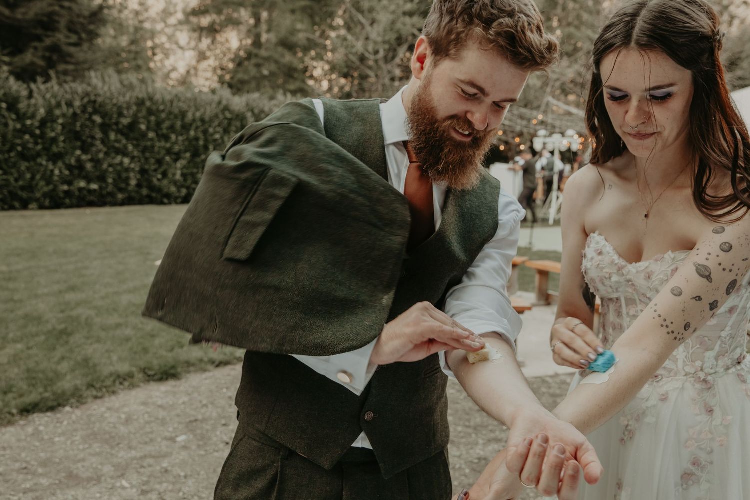 Couple shares intimate moments during outdoor wedding photoshoot in natural rustic setting.