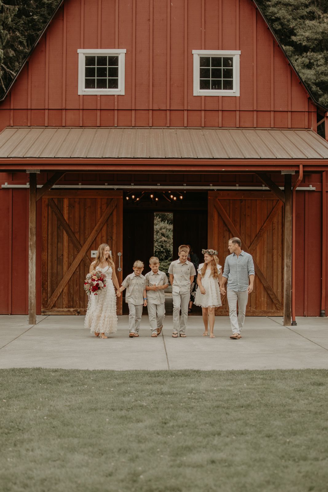 Bride and groom walk down aisle with their kids on Whidbey Island
